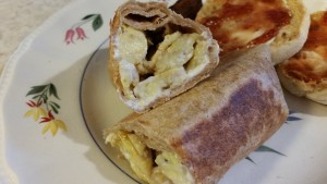 cut egg breakfast burrito with cream cheese