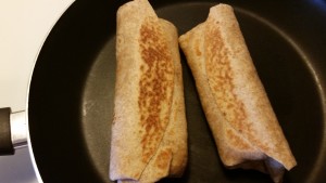 grilled egg and cream cheese breakfast burrito