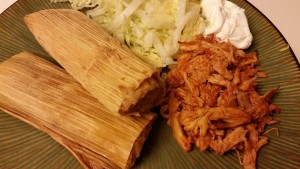tamales with chicken mole and salad
